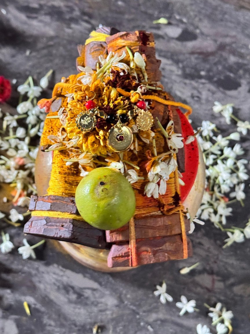 A small traditional offering decorated with flowers